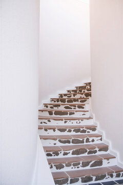 Minimalist architectural details of narrow alley in Greek island resort