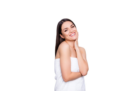 Cheerful funny positive toothy woman wrapped in white towel happy after procedure medical massage enjoying rest in spa center isolated on grey background wellness wellbeing concept