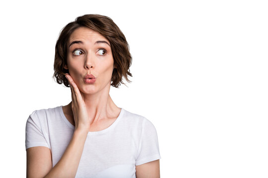 Portrait of young shocked surprised impressed girl woman female look in copyspace hold hands on cheek isolated on grey color background