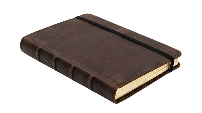 A closed brown leather journal with an elastic band for the concept of journaling and creativity.