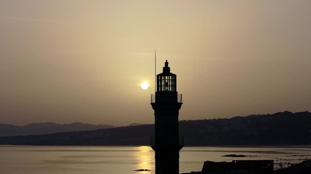  View of Chania with the amazing lighthouse, mosque, venetian shipyards, Crete, Greece.Waves crashing on lighthouse, Beautiful Greece and best scenic places - panorama