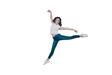 Graceful magnificent attractive pretty stylish trendy nice lovely cheerful curly-haired brunette girl in casual white t-shirt and jeans, flying in air, dancing like ballet, isolated on grey background © deagreez