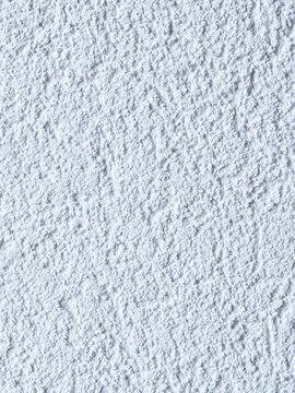 Light ice blue rough stucco wall texture background with coarse plaster grain relief for modern architectural rendering, cool product backdrop, and neutral graphic design