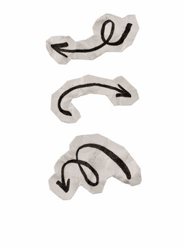 Hand drawn black ink arrow doodles on crumpled paper cutout scraps set isolated on white background, spiral and curved arrow collection for paper collage and scrapbooking design