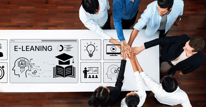 Diverse Group Collaboration in E-Learning Environment with Technology Icons and Teamwork Concept on Table. Bitwise.