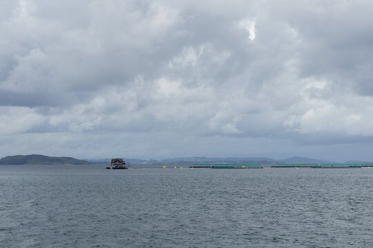 Salmon fish farming aquaculture industry in Norway fjord