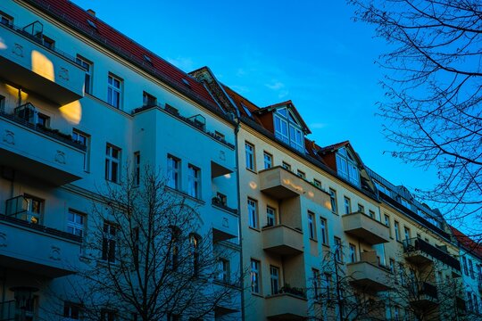 Apartment buildings under a bright blue sky
