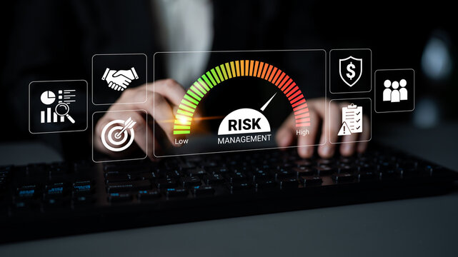 Professional Hands Typing on Keyboard with Risk Management Dashboard Displaying Low to High Risk Levels and Relevant Icons for Business Analysis. Glyphic.