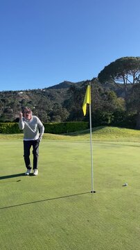 Mature Amateur Golfer Practicing His Swing on the Golf Course