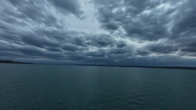 Ferry ride across Lake Constance between Konstanz and Meersburg, Germany, with views of open water, distant shoreline and surrounding landscape on an overcast day.