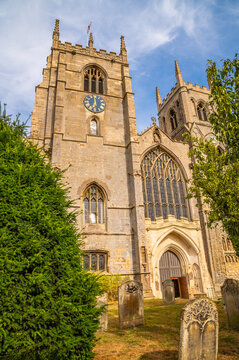 A view towards the front of King's Lynn Minster in the Saturday Market Place in King's Lynn, Norfolk, England in summertime