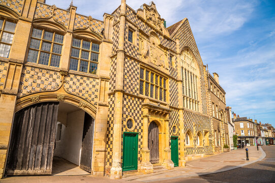 A view past the medieval Town Hall, towards the Saturday Market Place in King's Lynn, Norfolk , England in summertime
