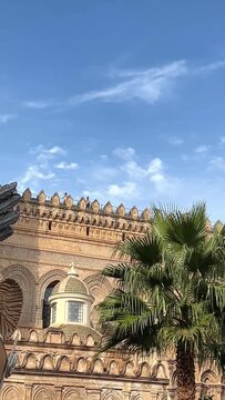 Statue of Santa Rosalia on the triumphal float with the Cathedral background, Palermo, Sicily, Italy. Panning shot of beautiful Arabic Norman architecture of Palermo central square with Cathedral.