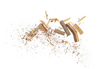 Firewood logs with tree bark and wood shavings isolated on white background