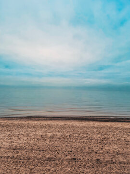 calm empty beach and sea on cloudy day