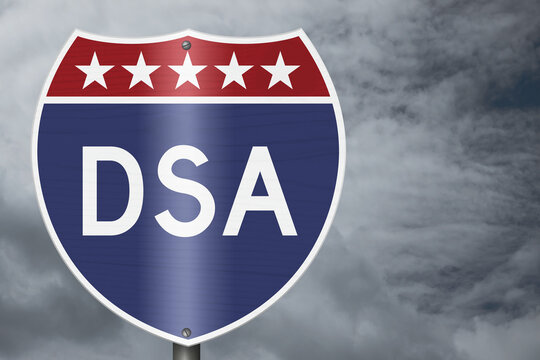 DSA text on an American interstate road sign with stormy sky for Democratic Socialists of America