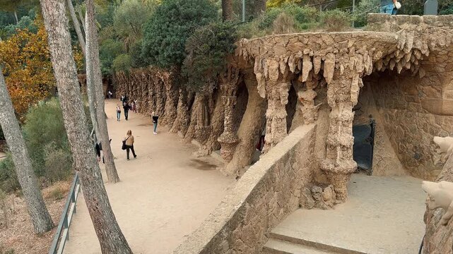 Discover the famous Park Guell in Barcelona, showcasing Antoni Gaudi's unique architecture, stone viaducts, gingerbread entrance pavilions, 