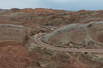 Colorful Zhangye Danxia mountains in Gansu, China, featuring layered rainbow rock formations, dramatic desert scenery and striking geology in a famous Danxia geopark. © JEREMIE