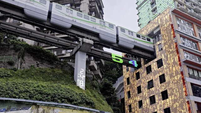 train enters liziba station inside a building on bridge in Chongqing china