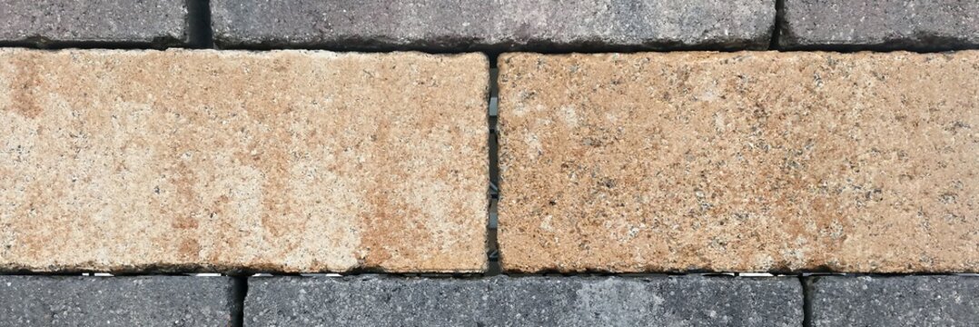Close up view of a wall featuring a pattern of interlocking concrete blocks