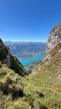 Expansive mountain view over Lake Walen from the Swiss Alps, symbolizing perspective, mental clarity, freedom, reflection and gaining distance from everyday life.