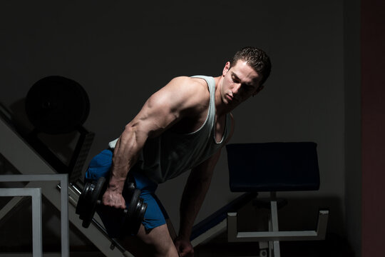Muscular Man Exercising Triceps
