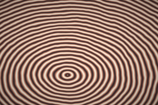Concentric circle pattern with brown and beige waves for hypnotic digital art backgrounds