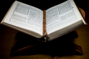 Fototapeta premium pages of holy koran and rosary at the book