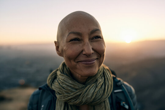 Smiling Bald Mature Woman Hiking at Sunset
