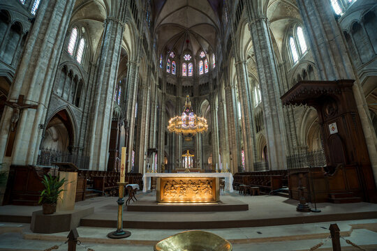 Gothic nave and main altar of Bourges Cathedral interior in France