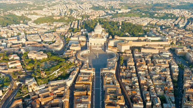 Rome, Italy. St. Peter's Basilica and Bernini's sweeping Tuscan colonnade, aerial descent at dawn over the Vatican's elliptical square and ancient obelisk. Drone footage