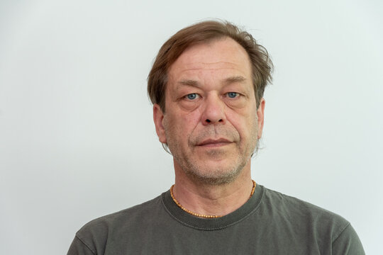 Isolated middle aged man with neutral expression on white background