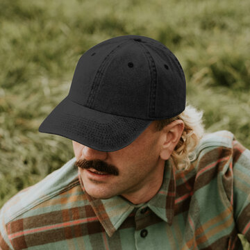 Man wearing black baseball cap, suitable as mockup