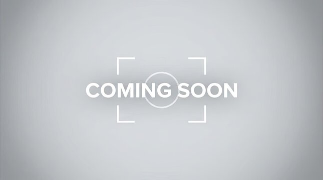 Coming soon text on grey gradient background with focus marks.