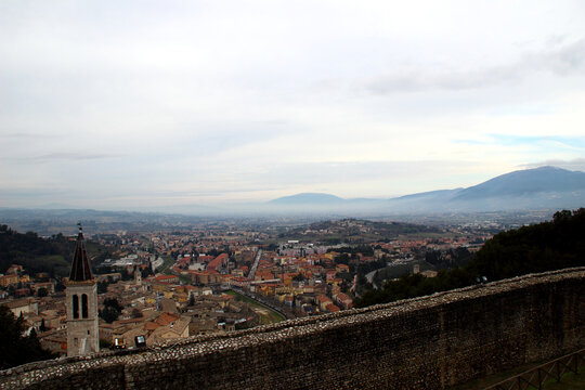 Enchanting view of Spoleto as seen from Rocca Albornoziana, overlooking the historic center and surrounding valley, bell towers and rooftops nestled against the Umbrian hills and distant mountains
