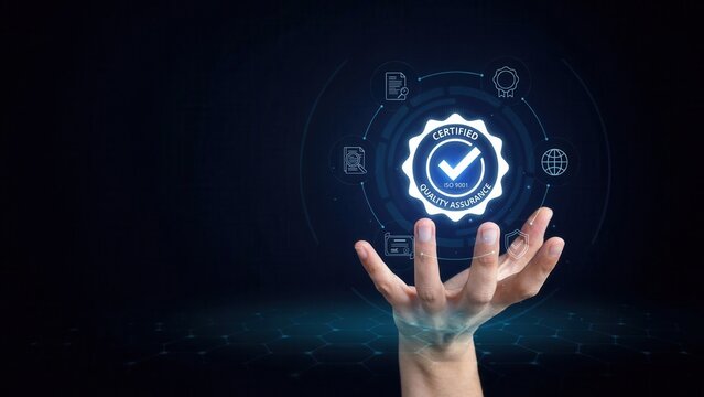 Digital quality assurance certification badge glowing above human hand represents ISO 9001 compliance standards with futuristic blue interface design elements