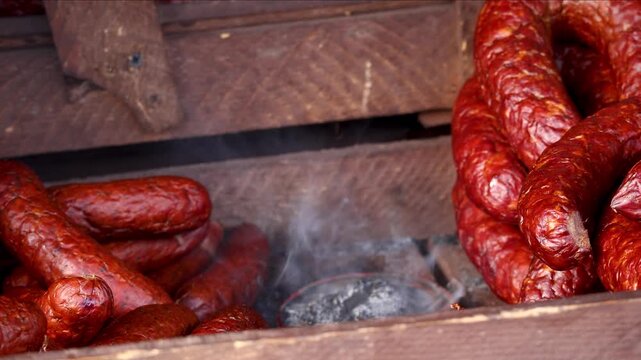 Traditional Smoked Sausages with Rising Smoke in Rustic Wooden Box