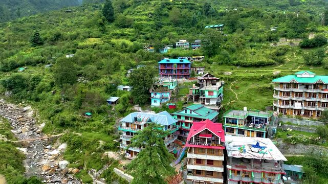 Drone pullback shot shows Beautiful Hill station Tosh, Kasol,  famous summer trekking basecamp in Kheerganaga, Parvati valley, Kullu.