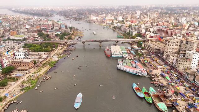 Aerial drone view of Sadarghat river port with passenger boats and dense Dhaka city