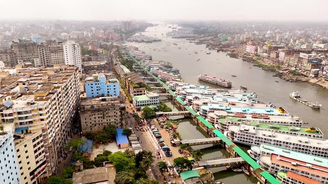 Aerial drone view of Sadarghat river port with passenger boats and dense Dhaka city