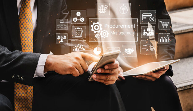 Business professionals engaged in procurement management using smartphone, tablet, and digital technology for strategic decision making in modern corporate environment. Bitwise.
