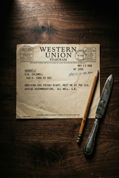 Vintage Western Union Telegram on a Rustic Wooden Table with a Knife and Pencil.
