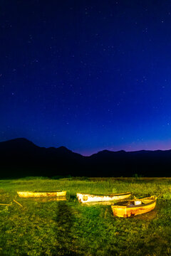 Rowboat in lagoon of tepetiltic nayarit at night with stars