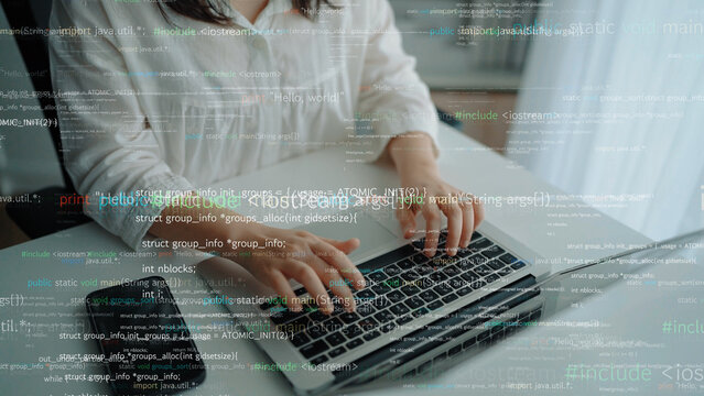 A woman is focused on programming while using a laptop in a bright home office. Code and data are visible on the screen, capturing the essence of modern software development. Xenic