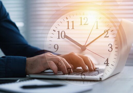 Time management concept with a professional working on a laptop and a large clock showing office work efficiency