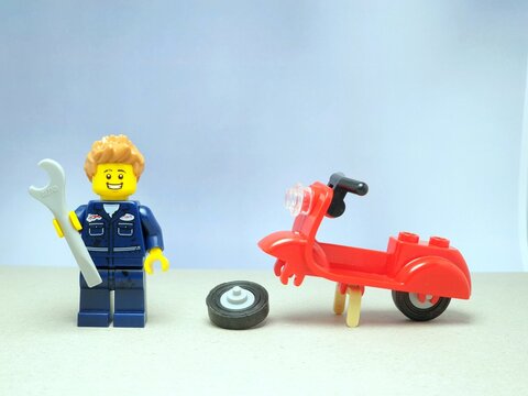 Indonesia - November 13, 2023 : Mini toy of lego at table with blurred background. Mechanic at garage concept design.