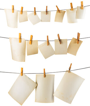 Isolated photo of blank vintage photos hanging on white background.