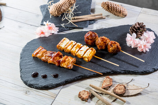 Grilled skewers assortment on black slate