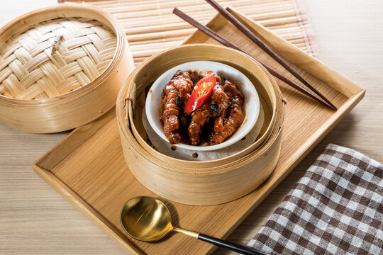 Dim sum chicken feet in bamboo steamer