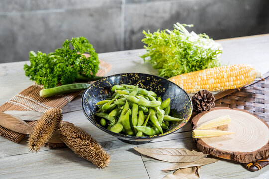 Salted edamame beans in rustic bowl